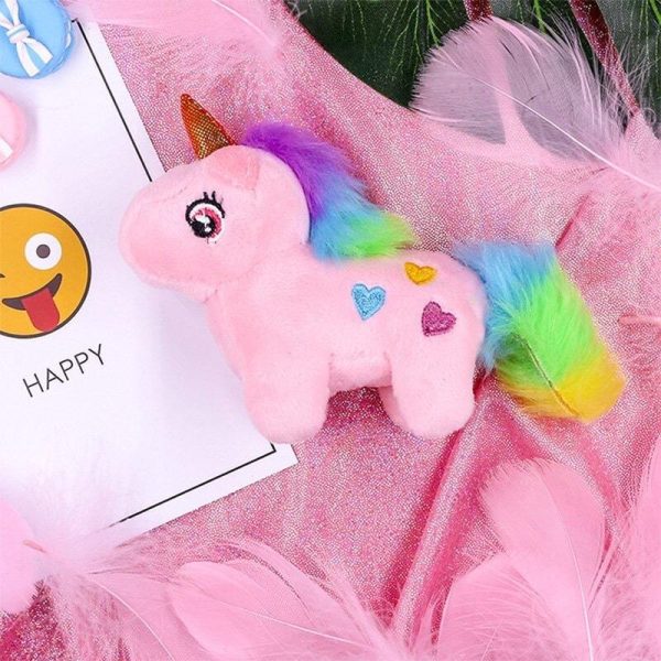 peluche licorne rose avec pendentif