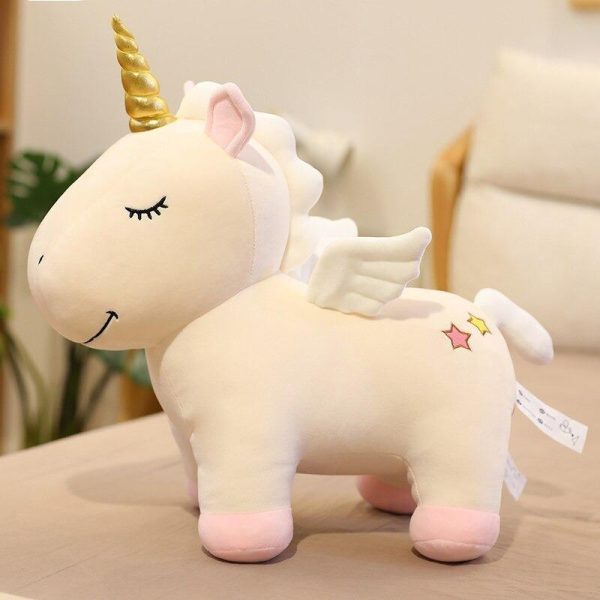 peluche licorne beige étoile en gros plan